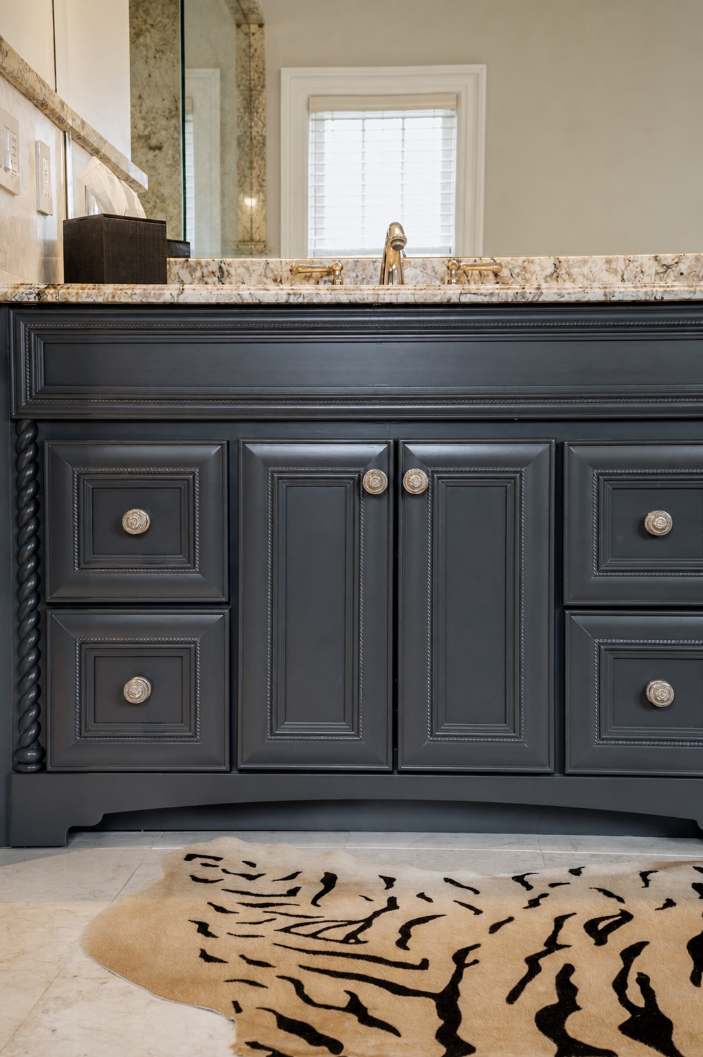Bathroom vanity refinished in charcoal with a smooth sprayed finish and polished hardware by Genesis Pro Painting