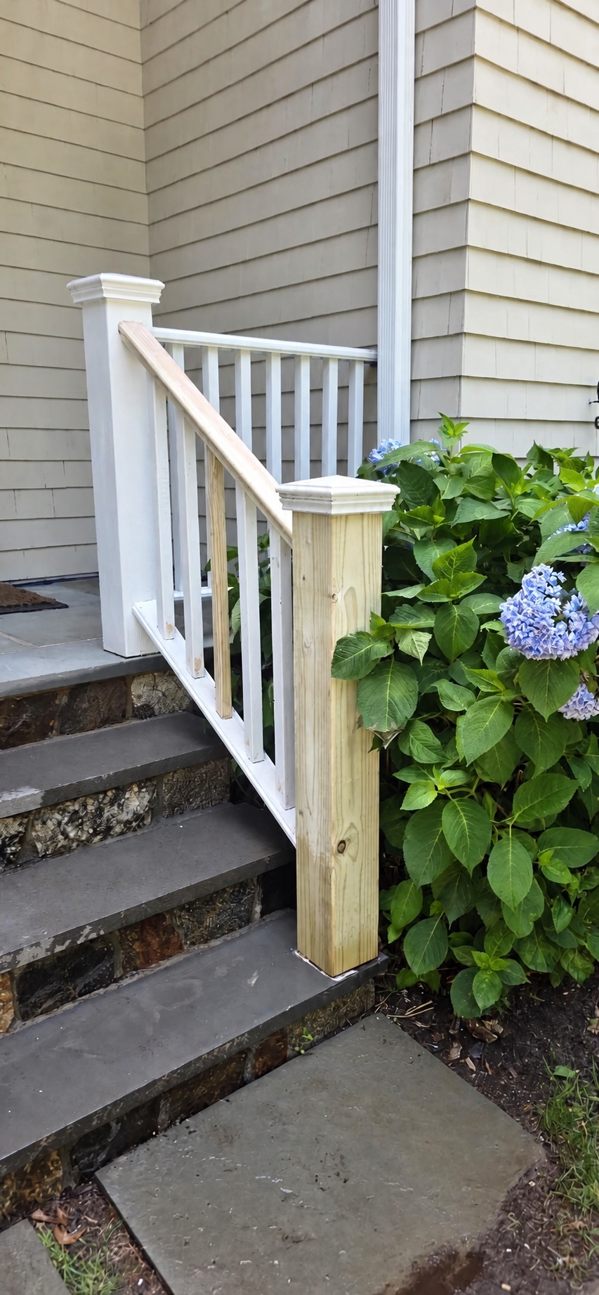 Repaired porch or deck woodwork prepared for a durable finish by Genesis Pro Painting