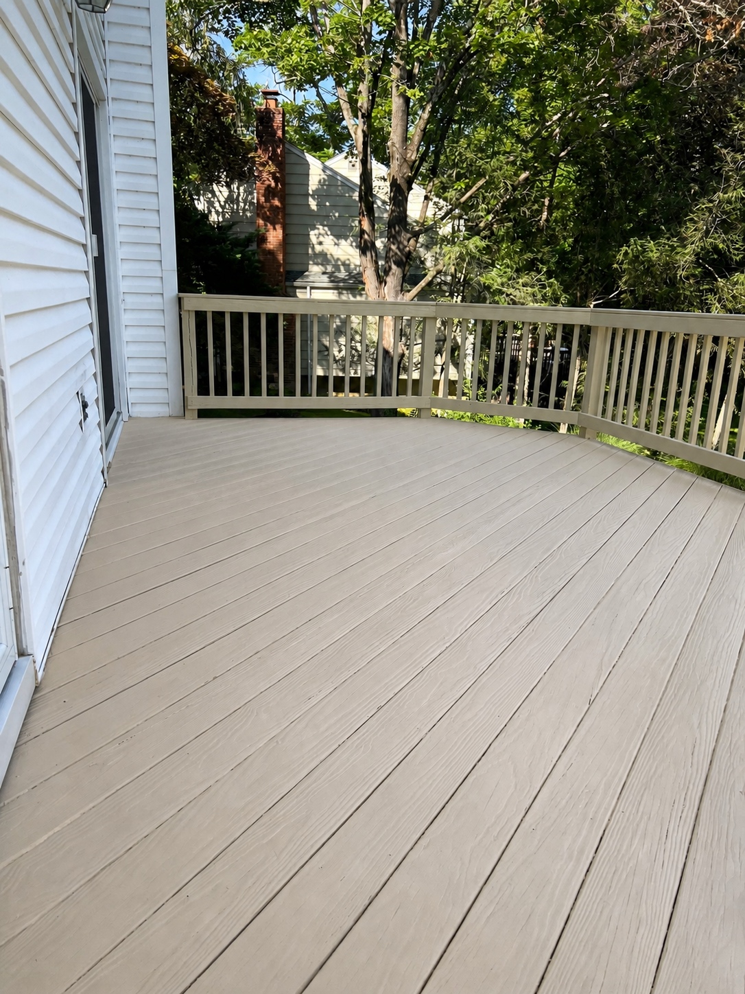 Refinished deck stairs and landing with consistent color by Genesis Pro Painting