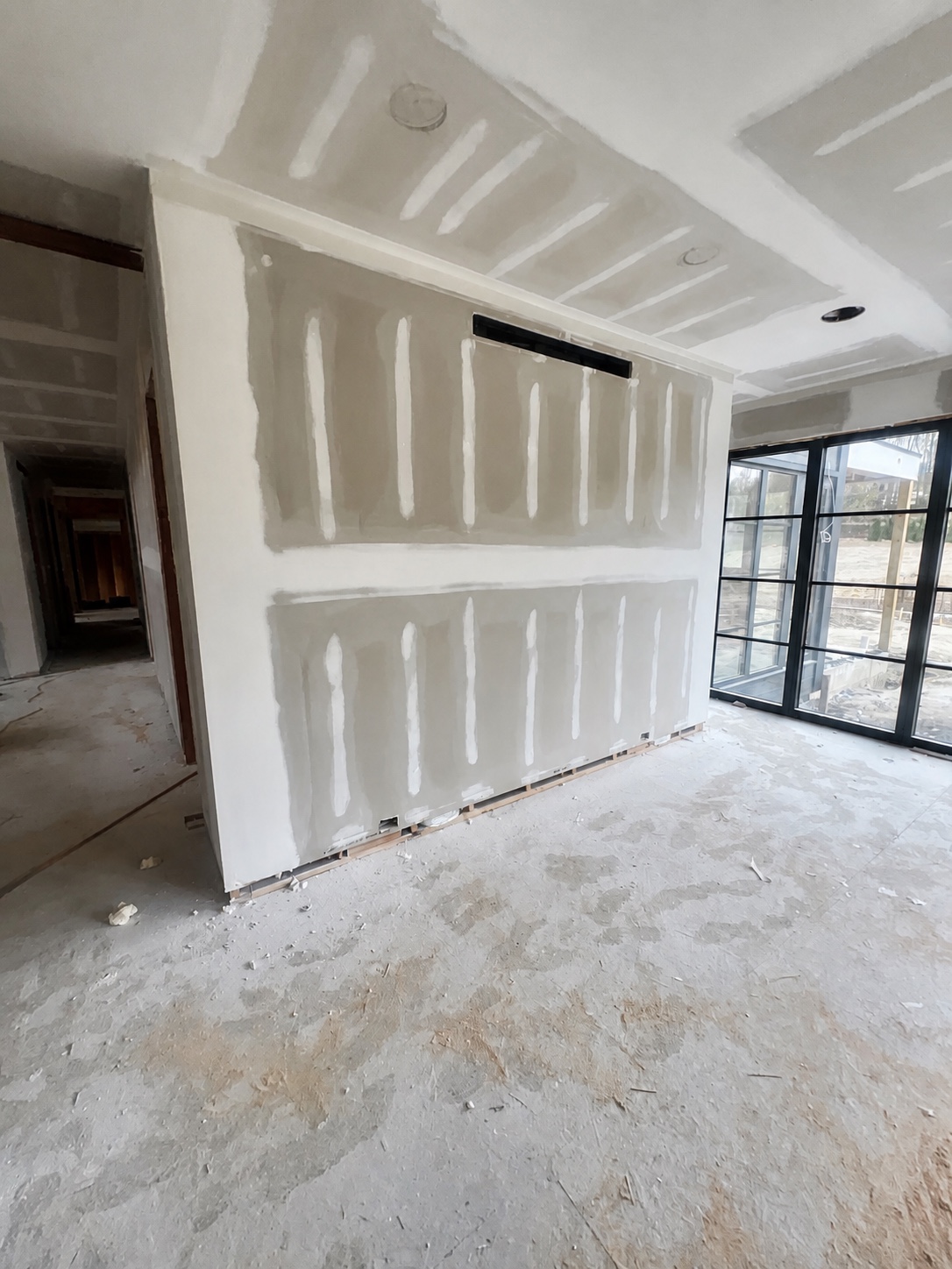 Repaired wall crack with even compound work and matching paint by Genesis Pro Painting