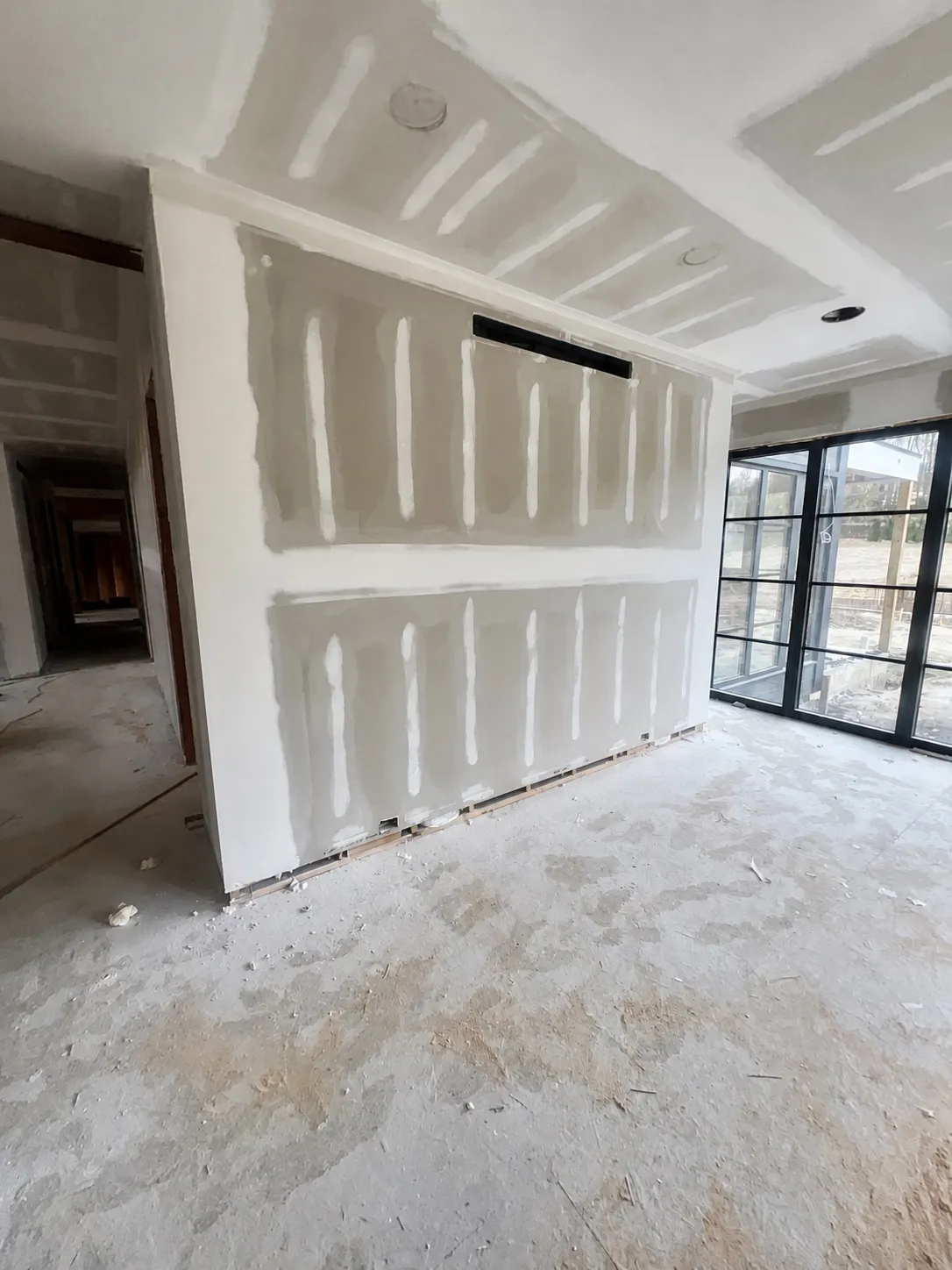 Repaired wall crack with even compound work and matching paint by Genesis Pro Painting