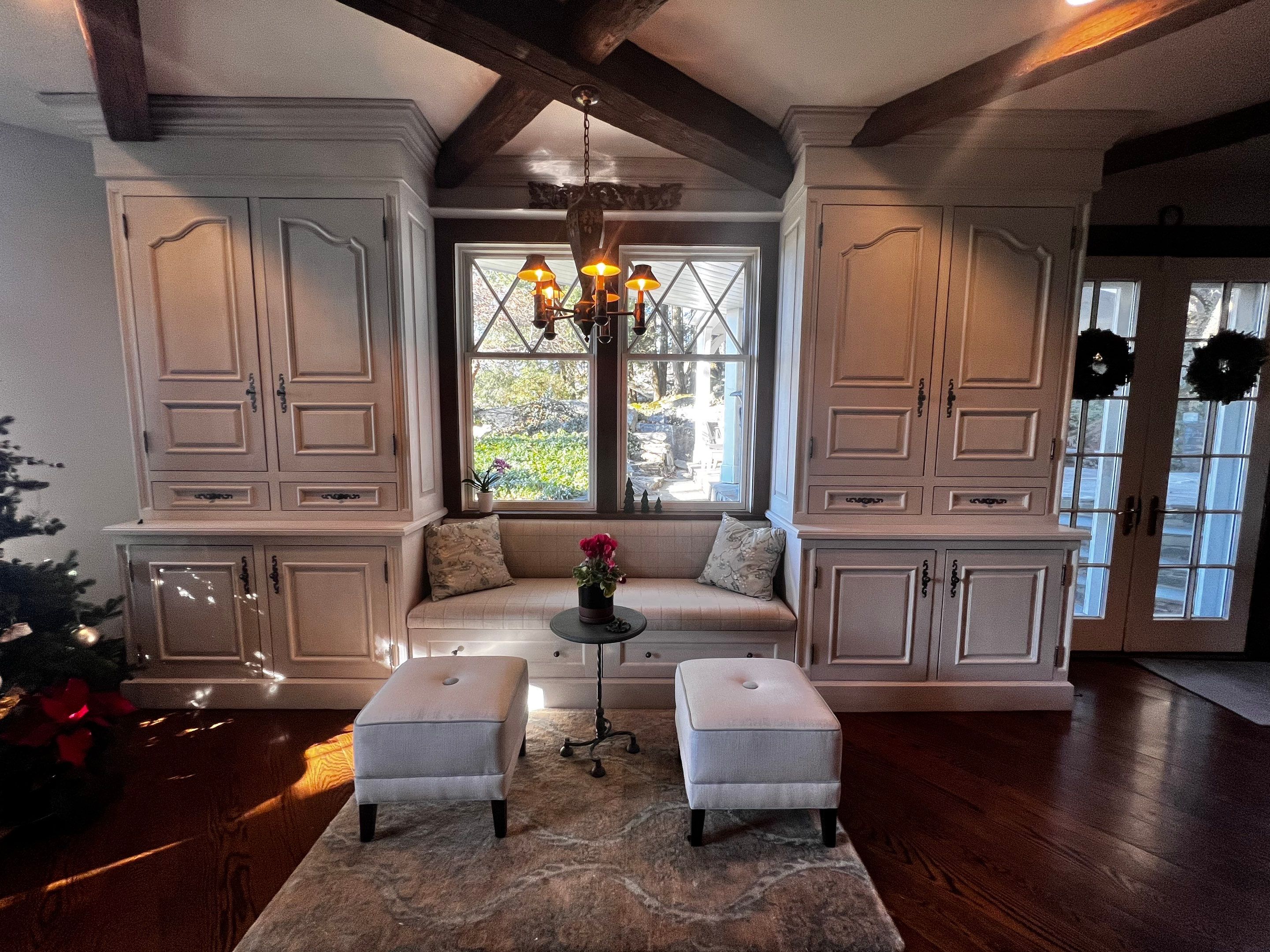 Interior painted family room with custom built-in cabinetry, shelving, and trim by Genesis Pro Painting