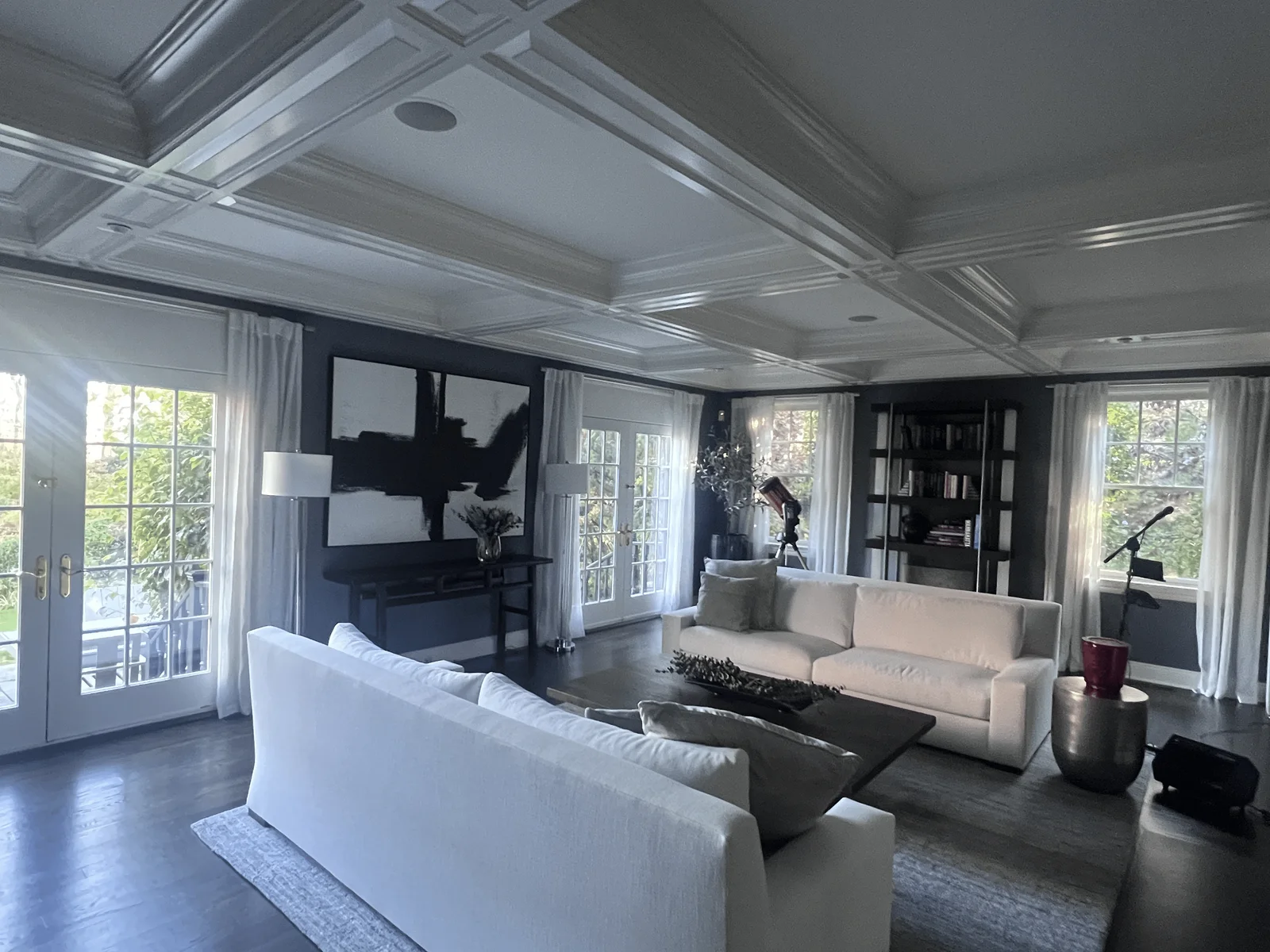 Interior painted living room with white coffered ceiling and deep accent walls by Genesis Pro Painting