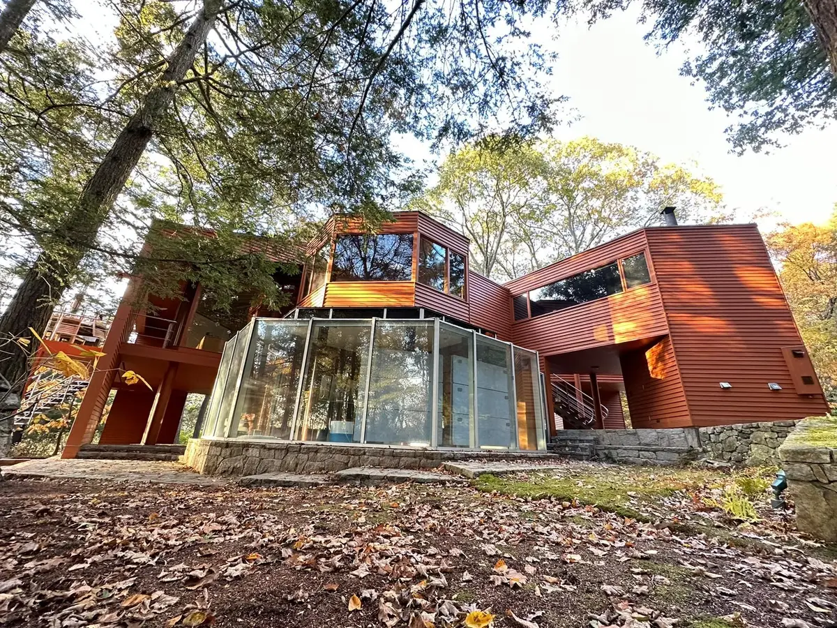 Reddish-brown horizontal wood siding on a contemporary house