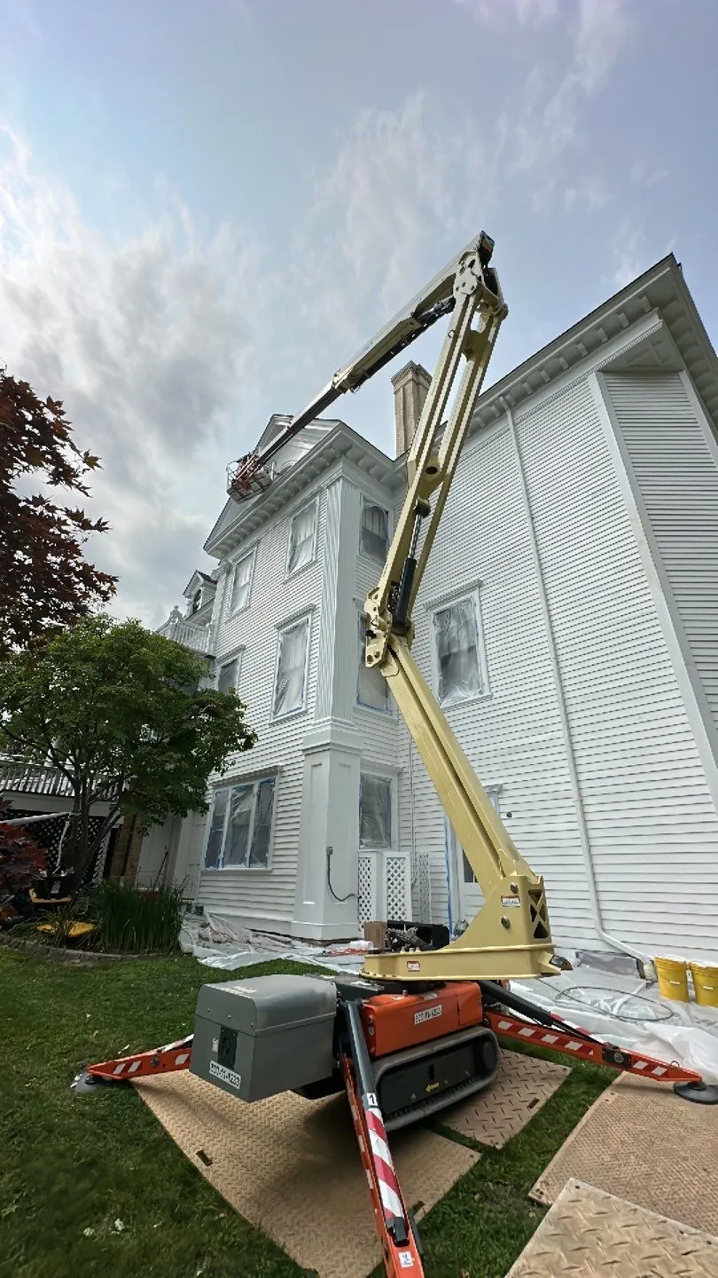 Lift access and protected windows during commercial exterior work at Lounsbury House in Ridgefield, CT