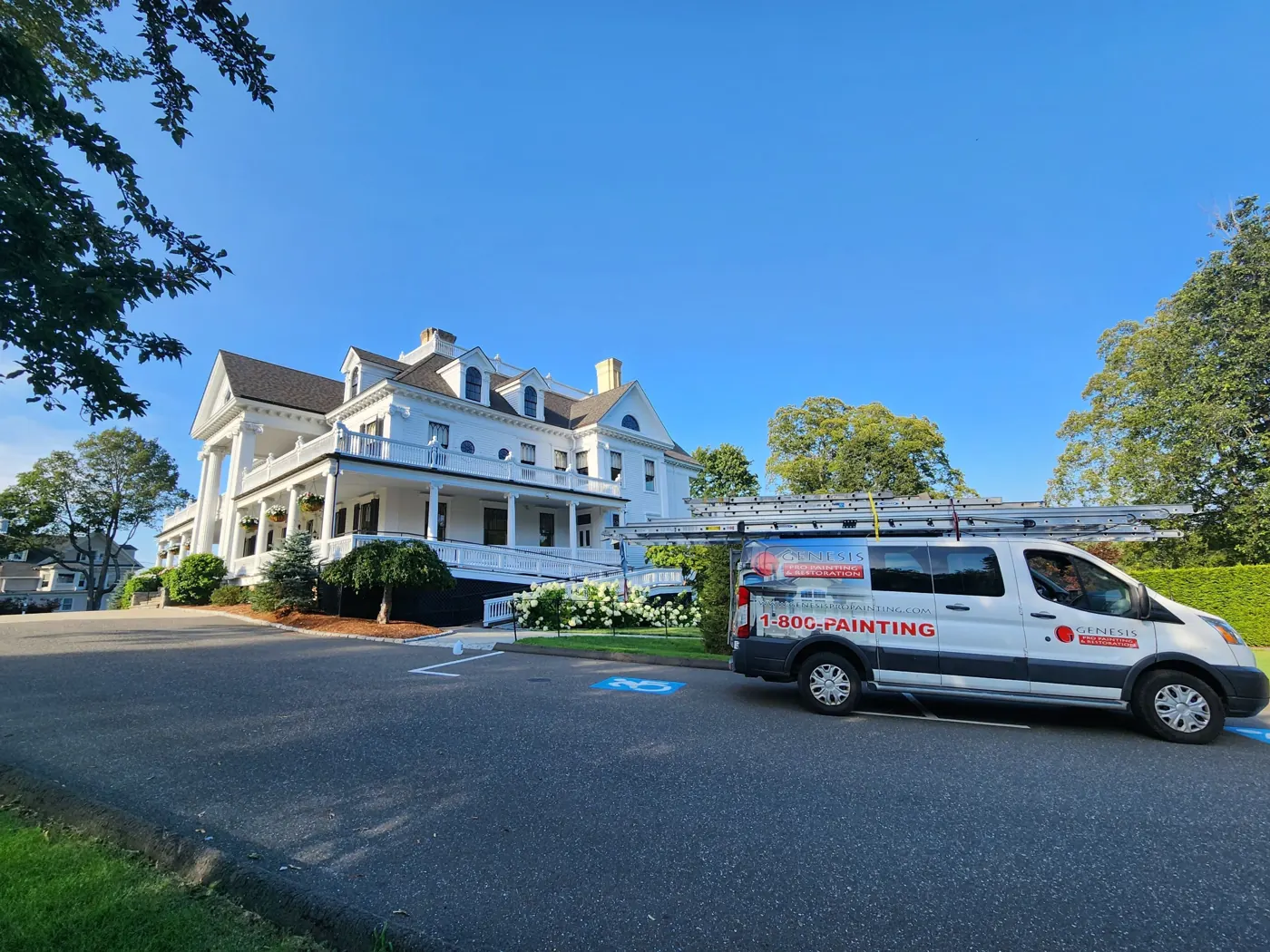 Genesis Pro Painting vehicle beside the painted Lounsbury House exterior in Ridgefield, CT